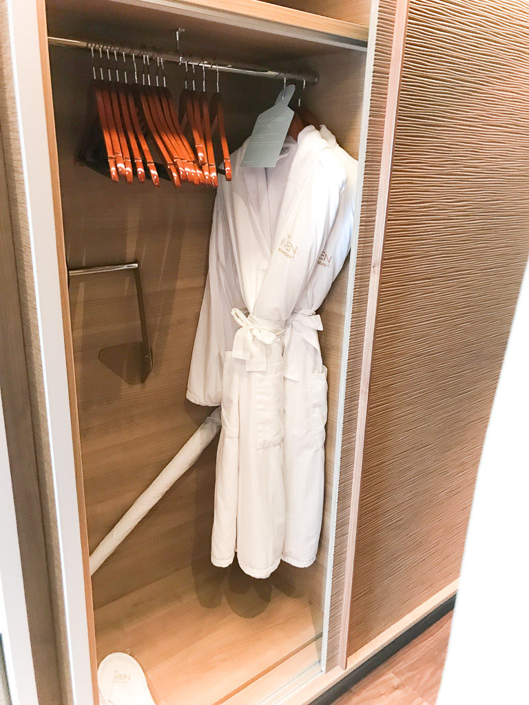 Closet and complimentary robes and slippers to use in Haven Spa Suite