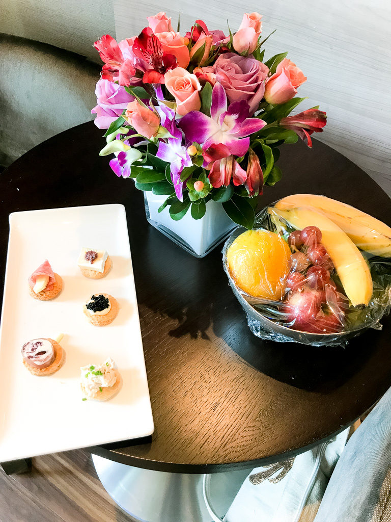 Canapes, fruit bowl and fresh flowers in Haven Spa Suite