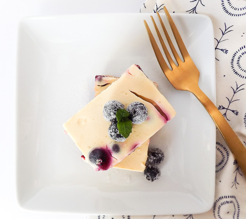 Lighter Lemon Blueberry Cheesecake Bars overhead picture with fork | asprinkleandasplash.com