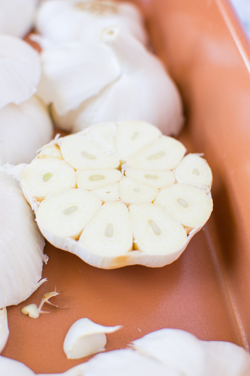 Cut garlic in pan | asprinkleandasplash.com