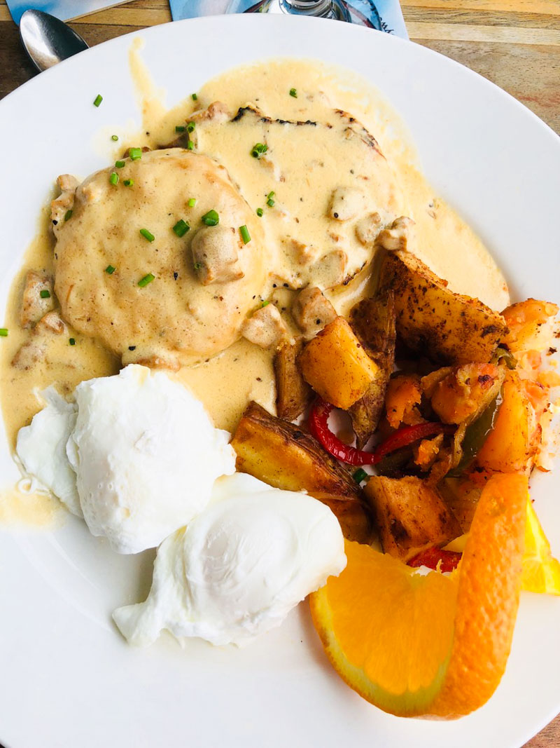 Biscuits and Gravy with poached eggs and home fries