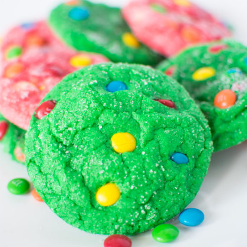 Close up of green cookie on a pile of cookies