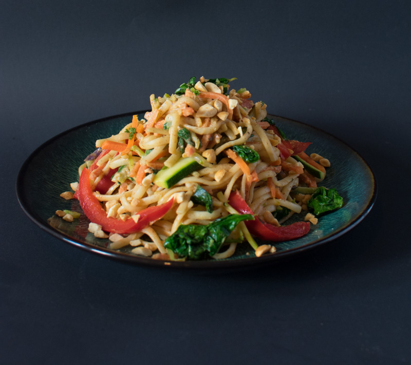 Plate of Spicy Almond Butter Vegetarian Noodles with a dark background
