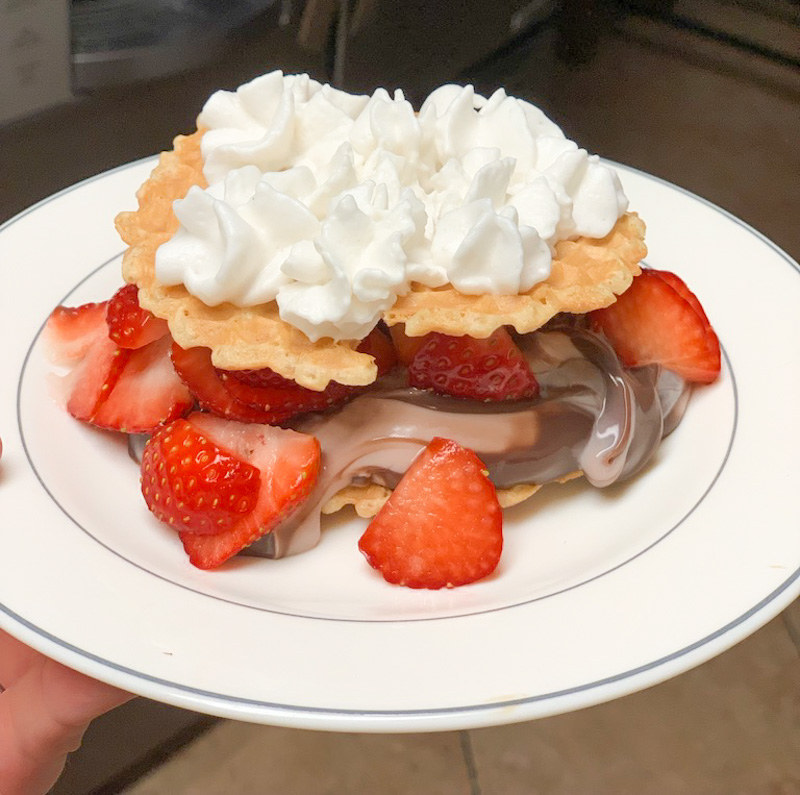 Dessert made with sugar free pudding, strawberries, pizelle cookies and almond milk whipped cream