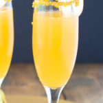 Closeup view of one glass of apple cider mimosa