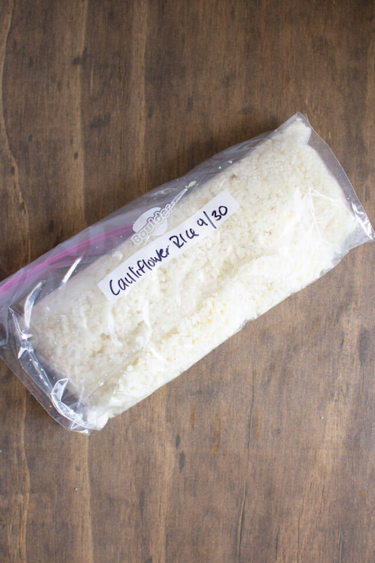 fresh cauliflower rice in ziploc bag ready for the freezer