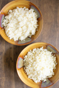 Overhead view of cauliflower rice two ways in bowls