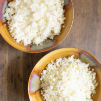 Overhead view of cauliflower rice two ways in bowls