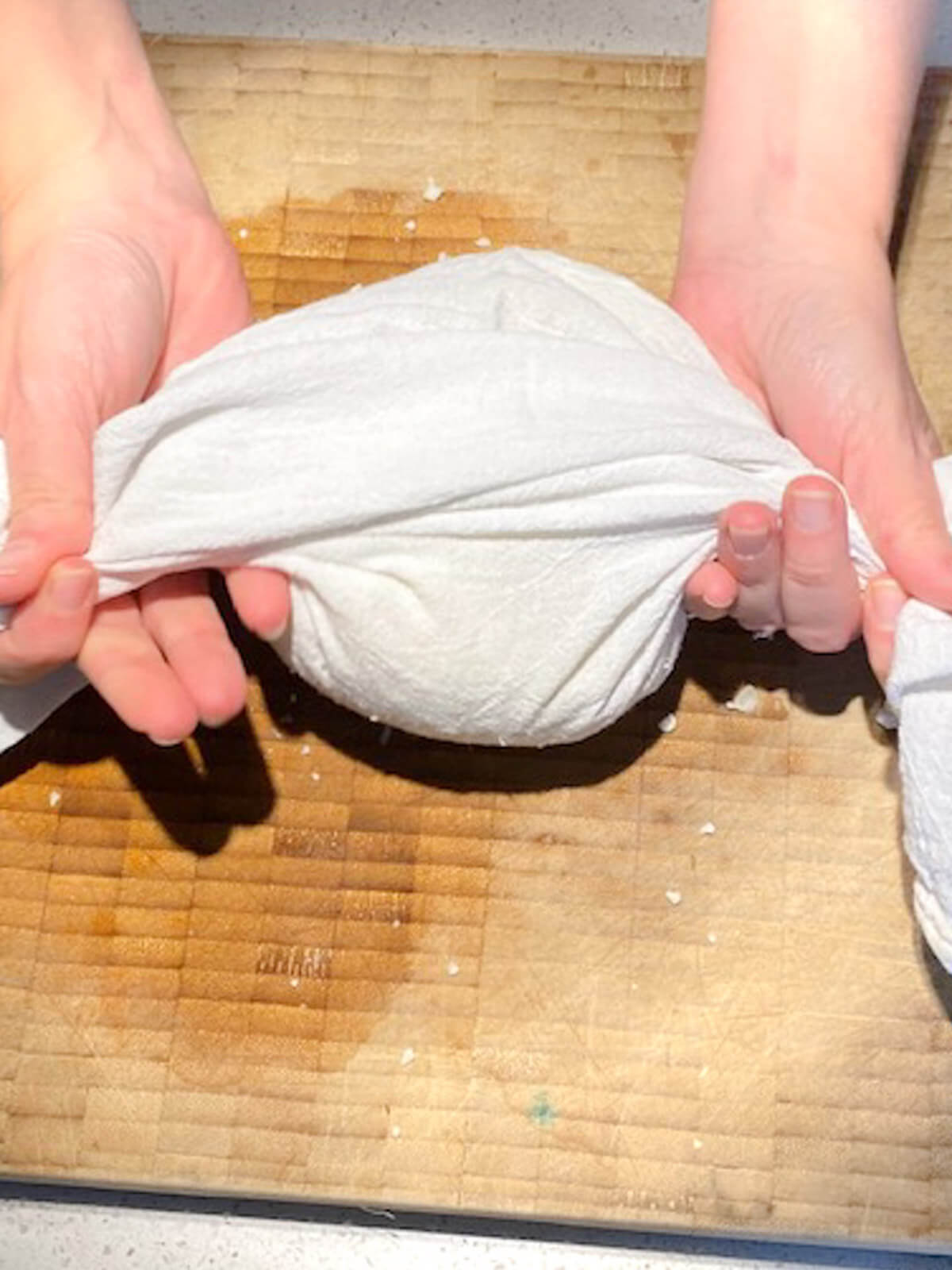 Wrapping cauliflower rice in flour sack towel