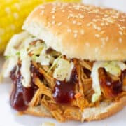 closeup of a bbq chicken sandwich with coleslaw