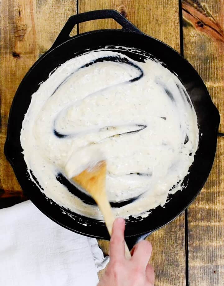 stirring cream cheese and half and half until melted and a creamy sauce has formed