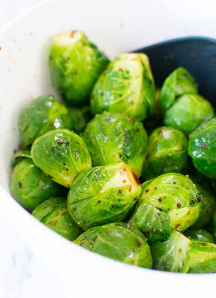close up of seasoned Brussels sprouts before cooking