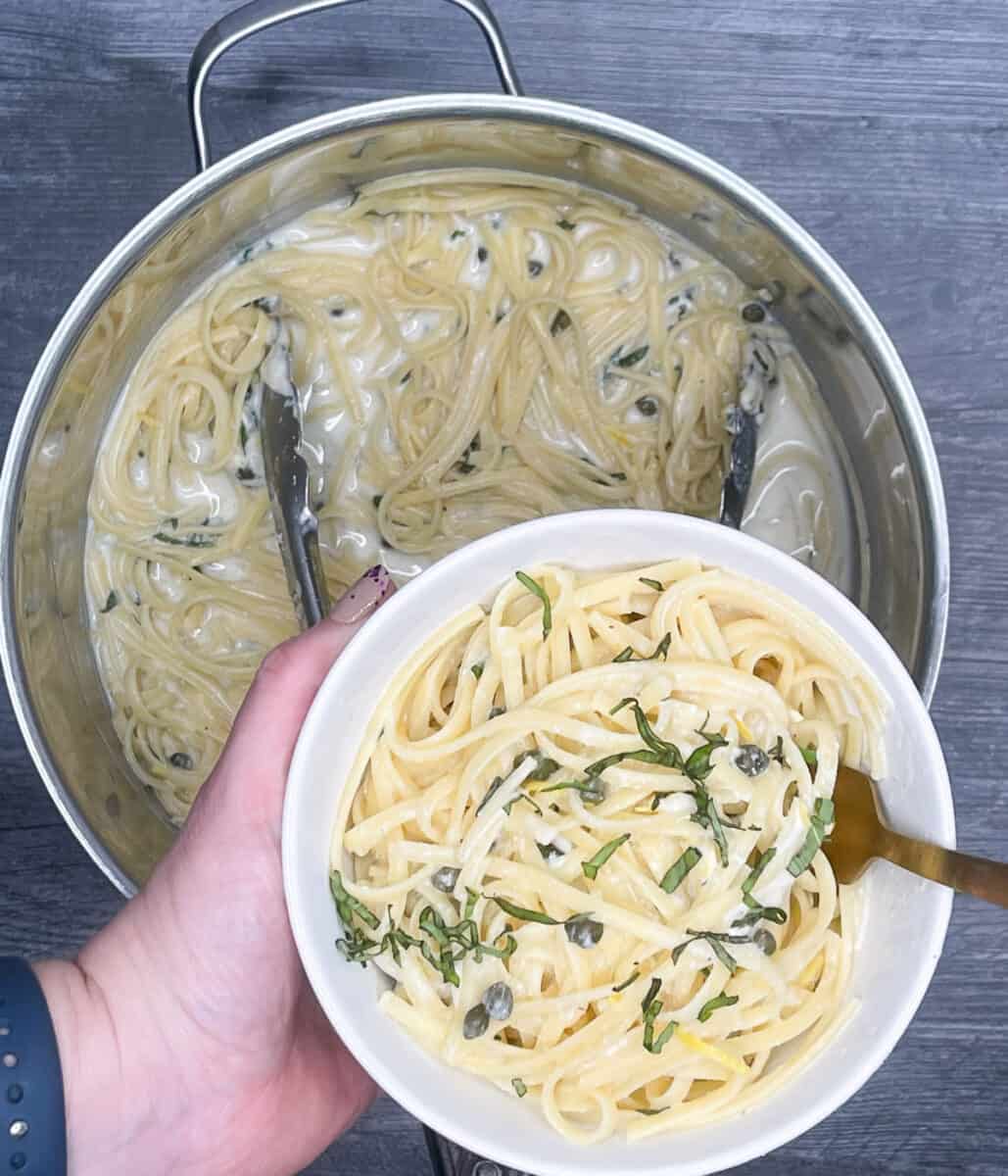 serving a bowl of one pot pasta with ricotta and lemon