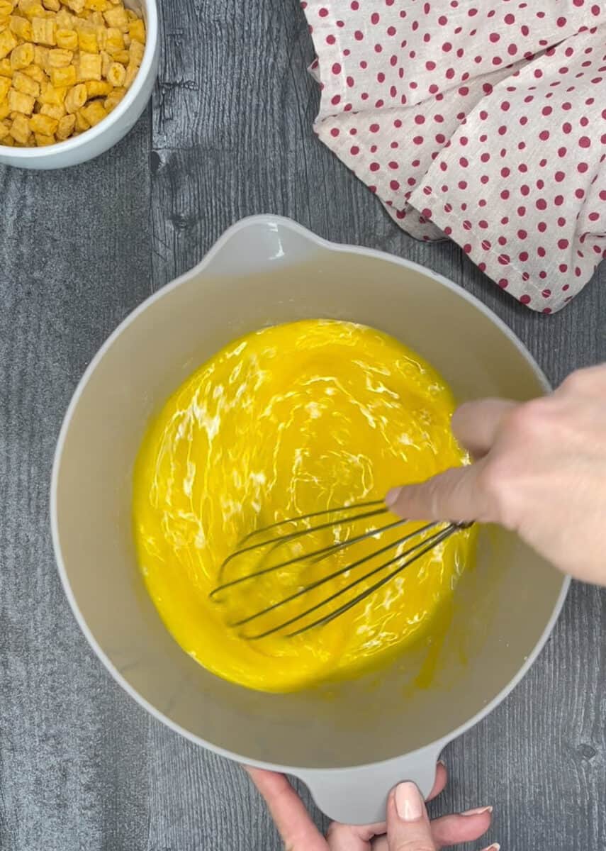 whisking eggs in a mixing bowl