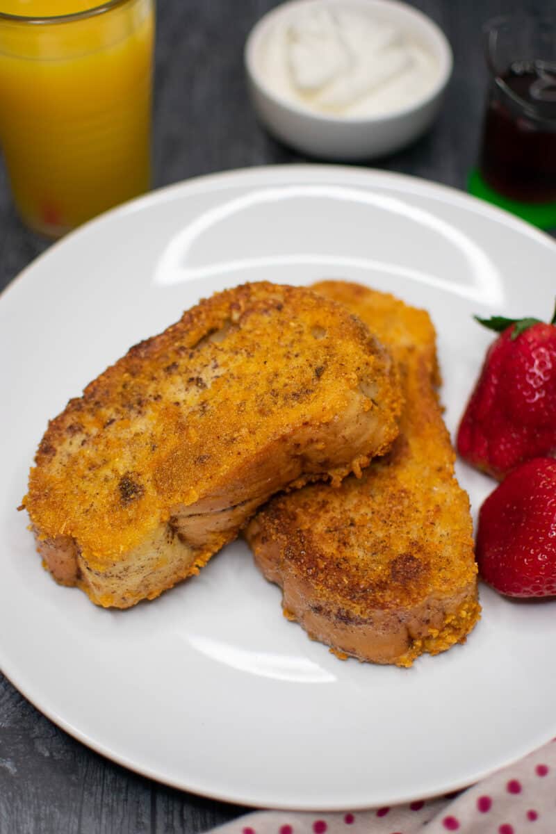 closeup of cooked French toast on a white plate