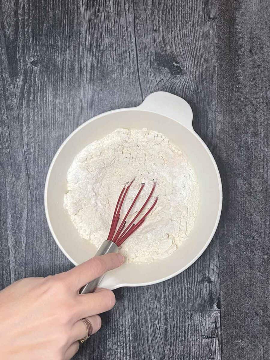 mixing dry ingredients together for dough