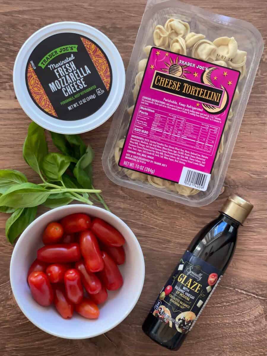 all ingredients needed to make the cheese tortellini caprese pasta salad
