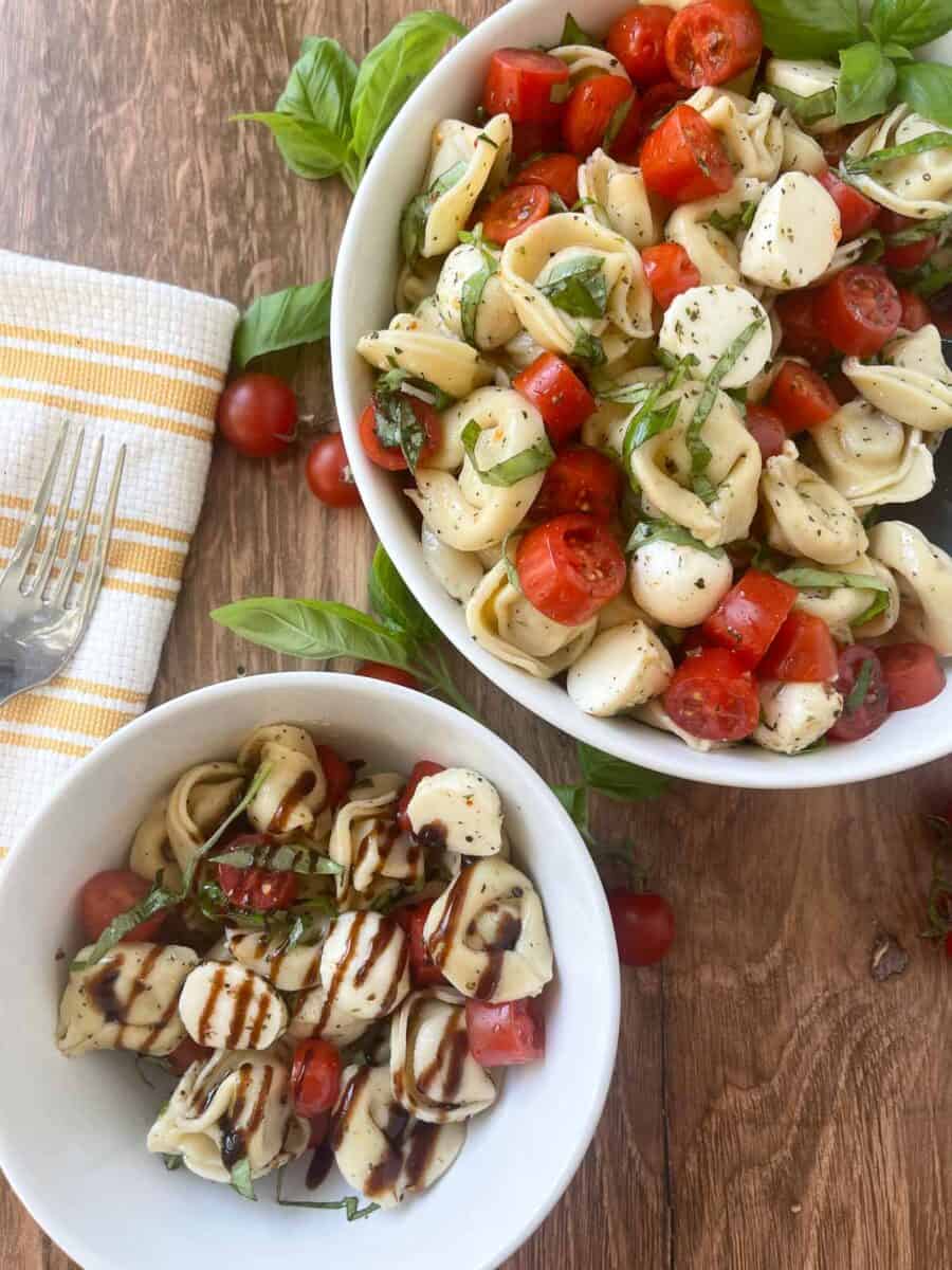 overhead view of a serving of pasta salad with balsamic glaze drizzled over the top