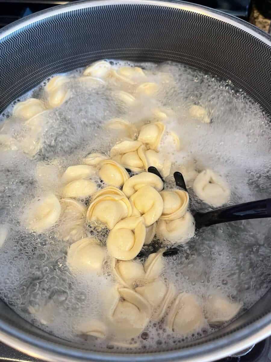 cheese tortellini boiling in a pot of salted water