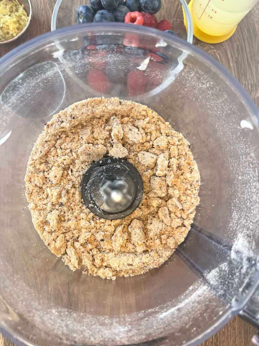 crust is mixed together in a food processor and ready for the pan