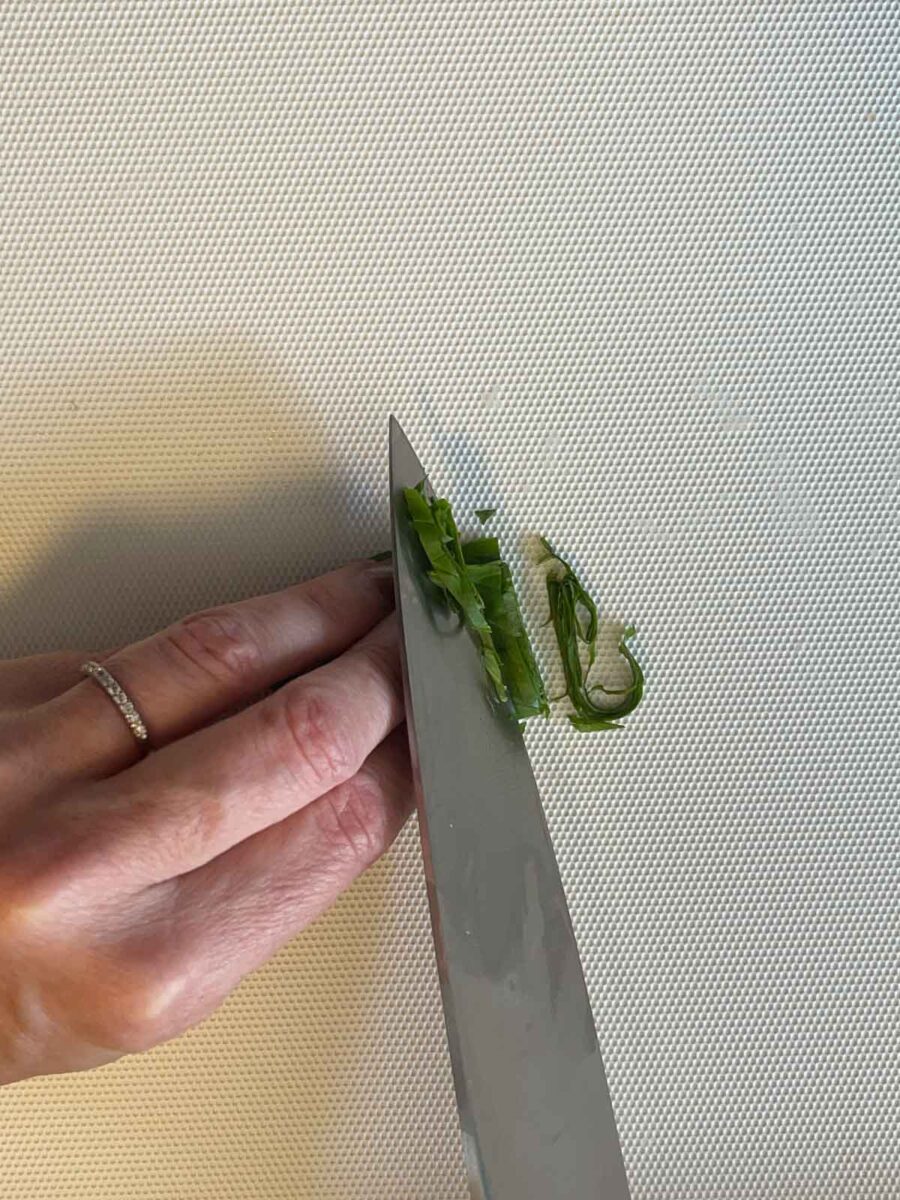 demonstration of how to julienne fresh basil