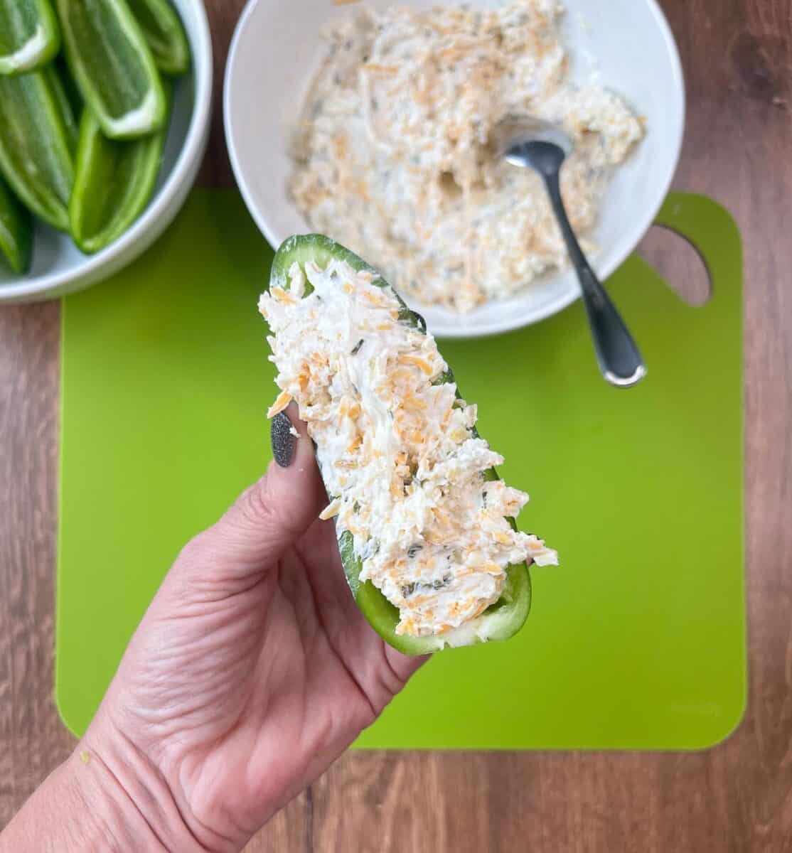 overhead view of a jalapeño half stuffed with cream cheese mixture