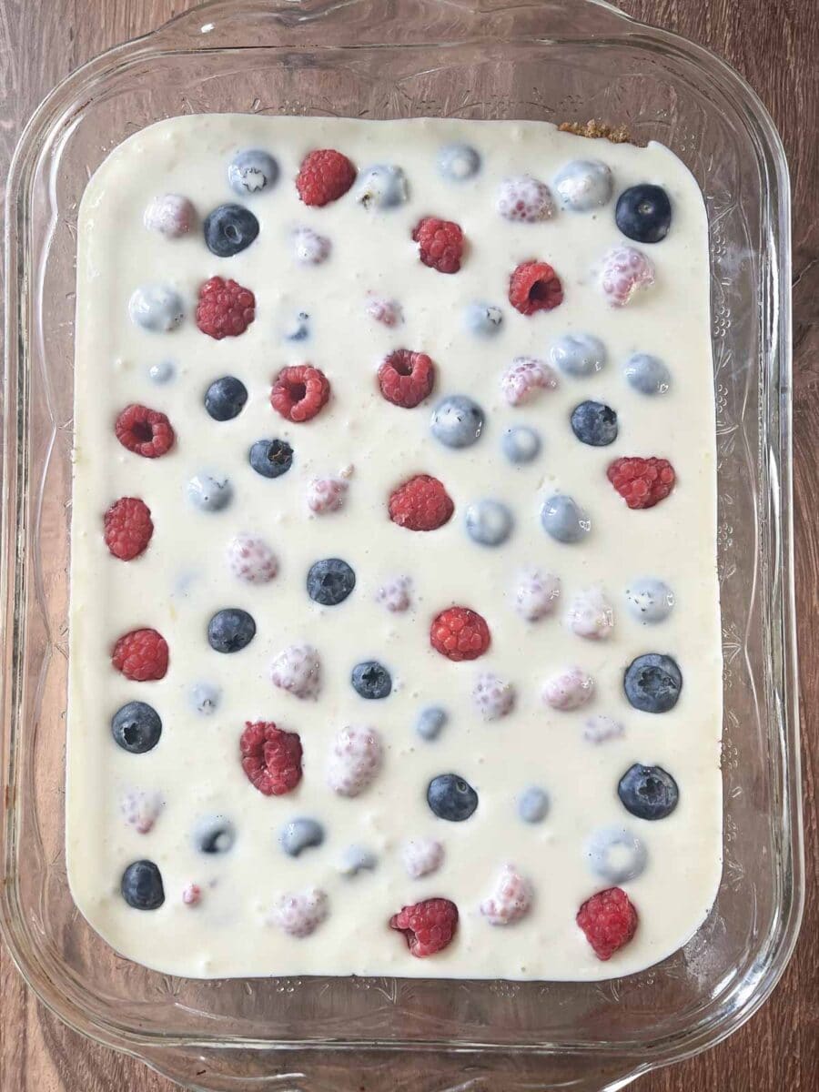 overhead view of cheesecake bars in baking dish ready to go in the oven