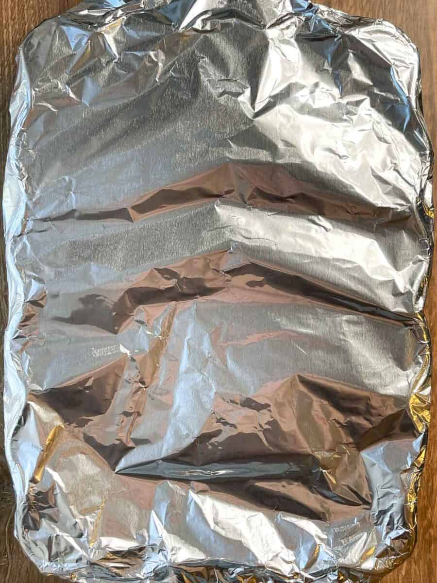 dish is covered tightly with aluminum foil