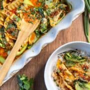 overhead view of viral dumpling bake recipe in baking dish and a serving in a bowl