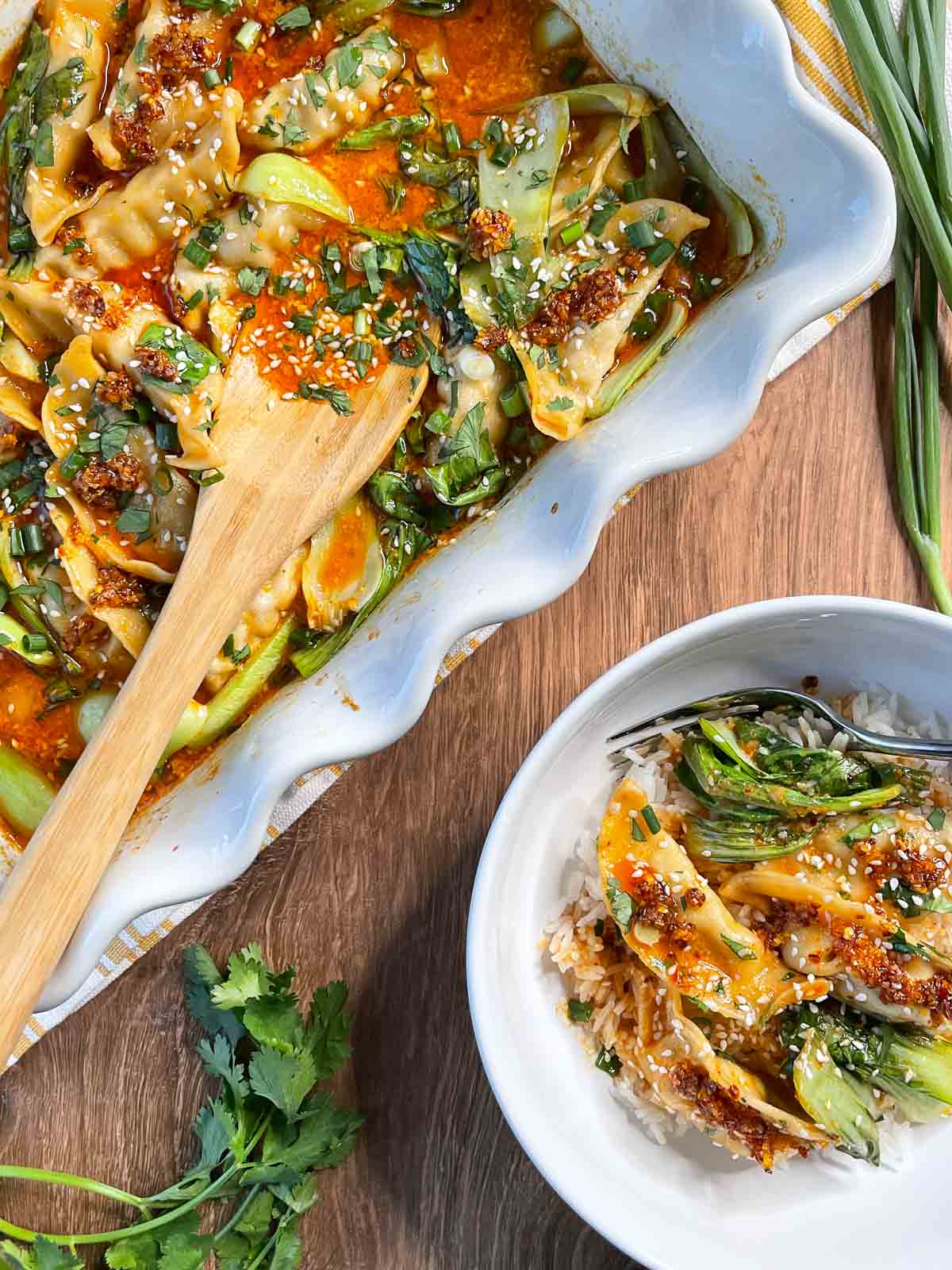 overhead view of viral dumpling bake recipe in baking dish and a serving in a bowl