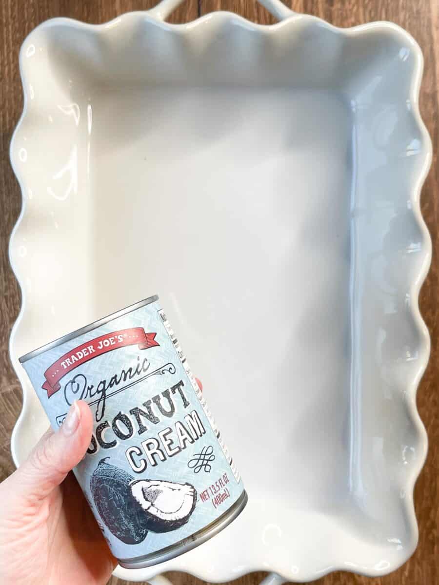 can of coconut cream about to go in white baking dish