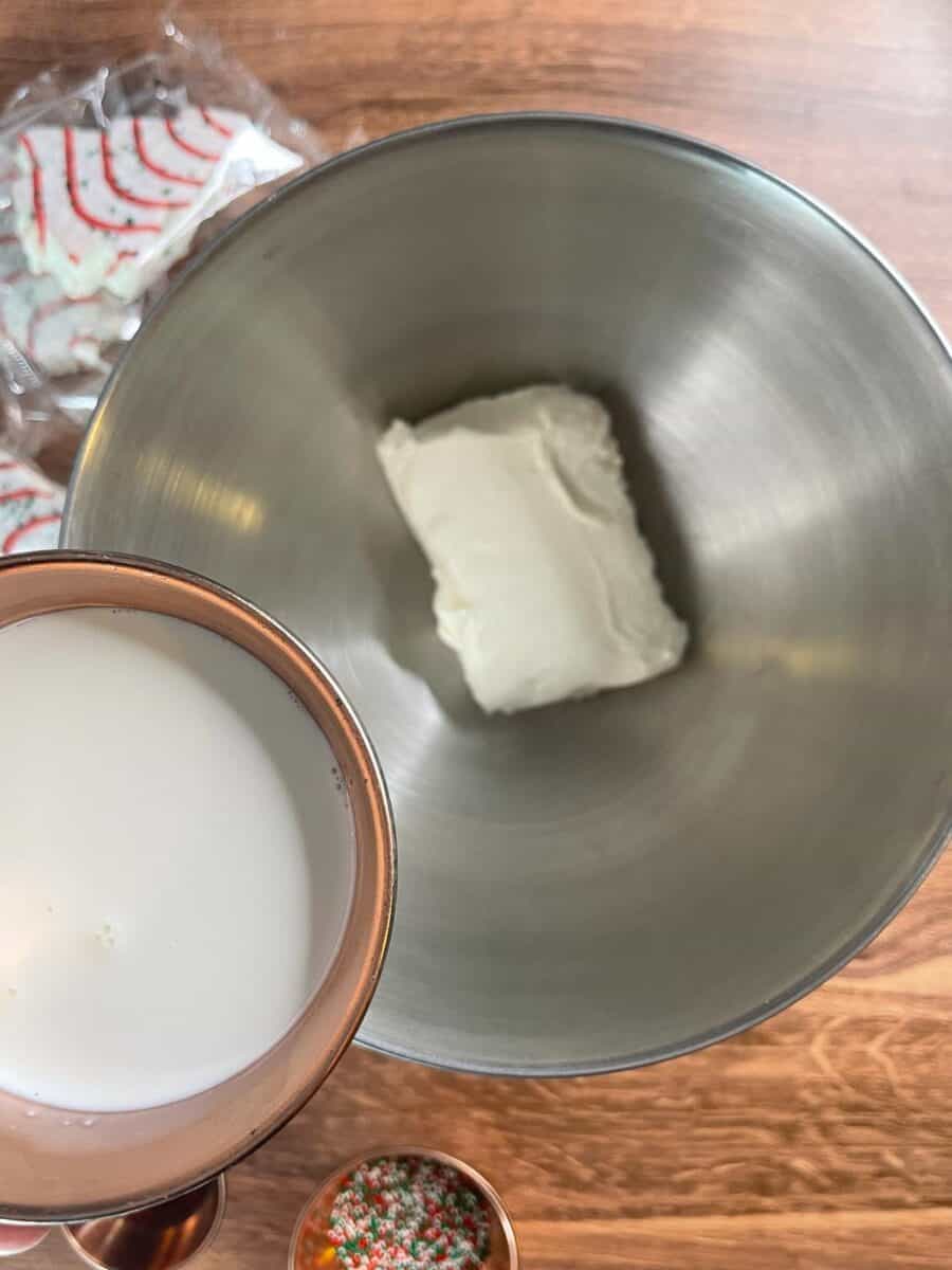 Adding half and half and cream cheese to mixing bowl