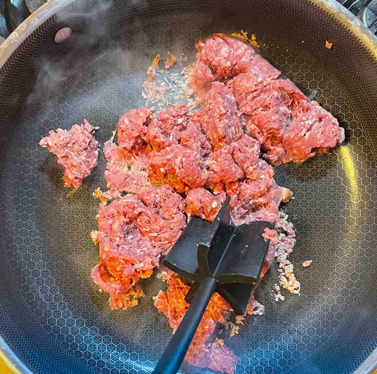 browning ground beef in a skillet