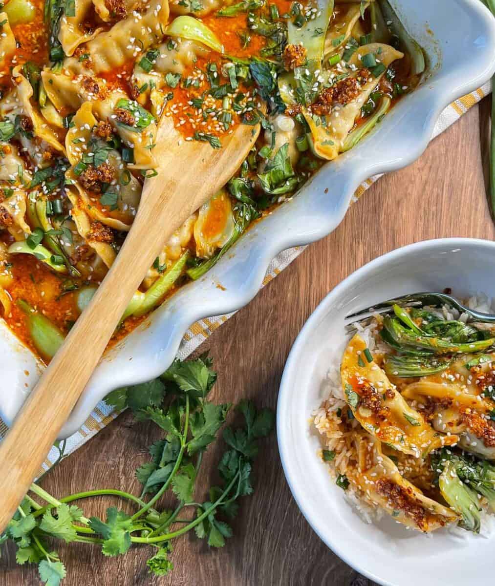 overhead view of viral dumpling bake recipe in baking dish and a serving in a bowl