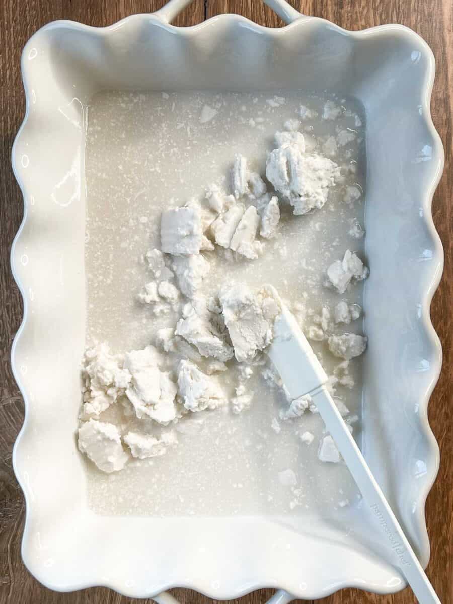 coconut cream has been added to a white baking dish