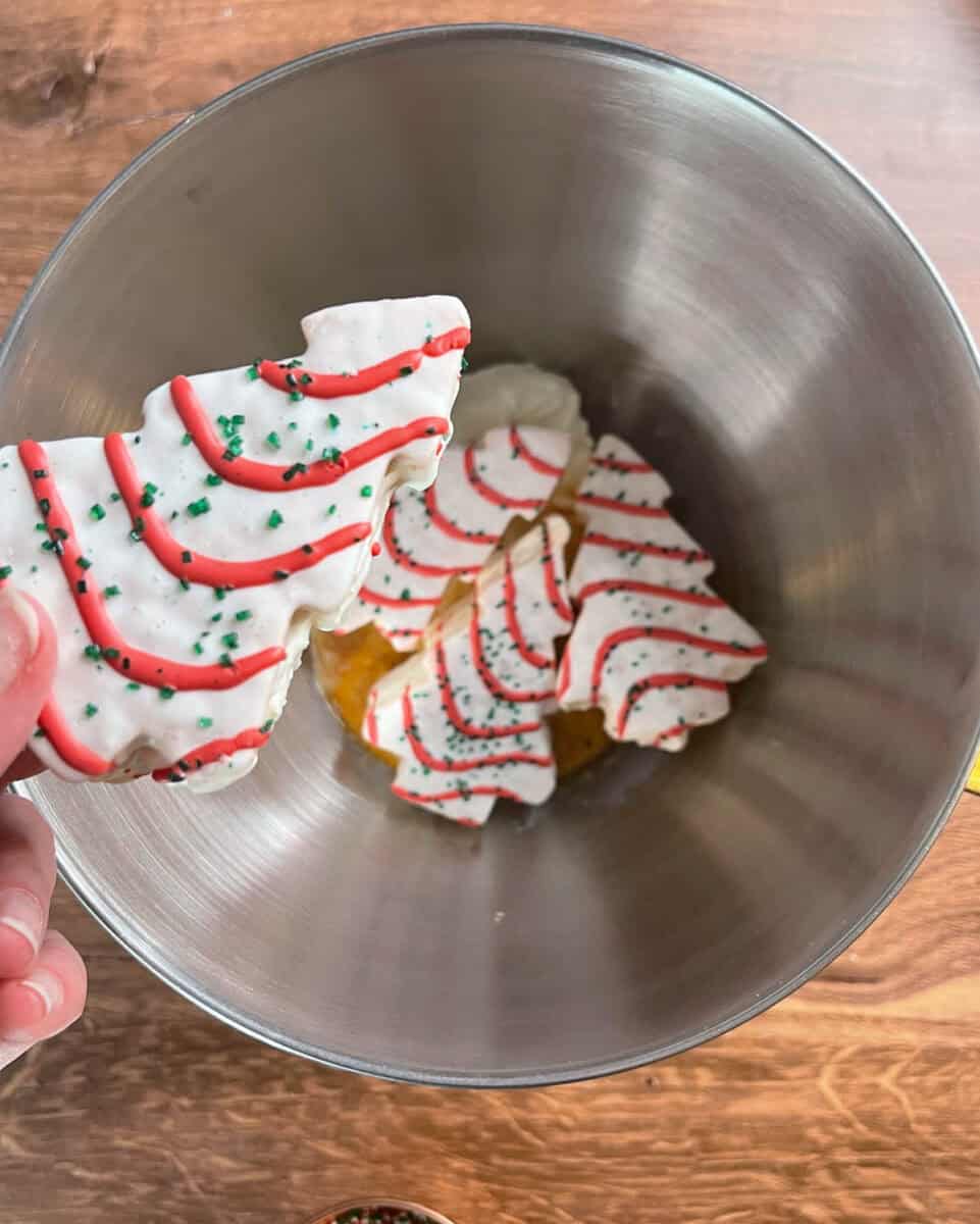 adding christmas tree cakes to mixing bowl