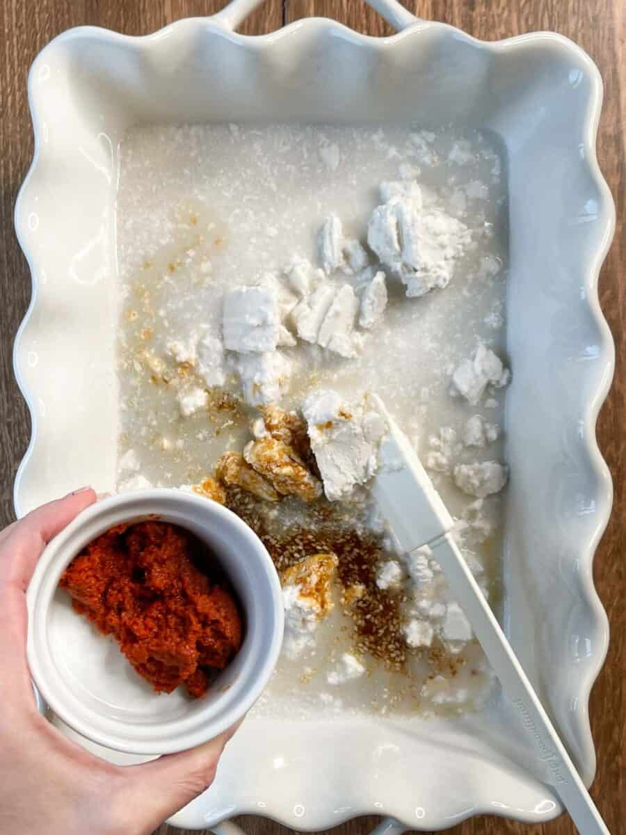 about to add red curry paste to white dish