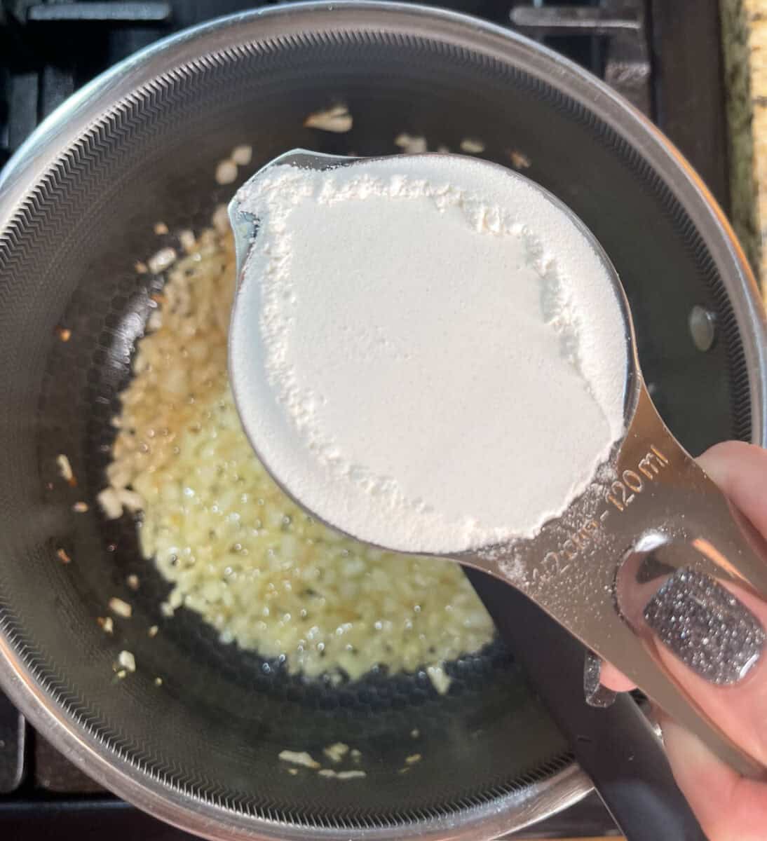 Adding flour to pot