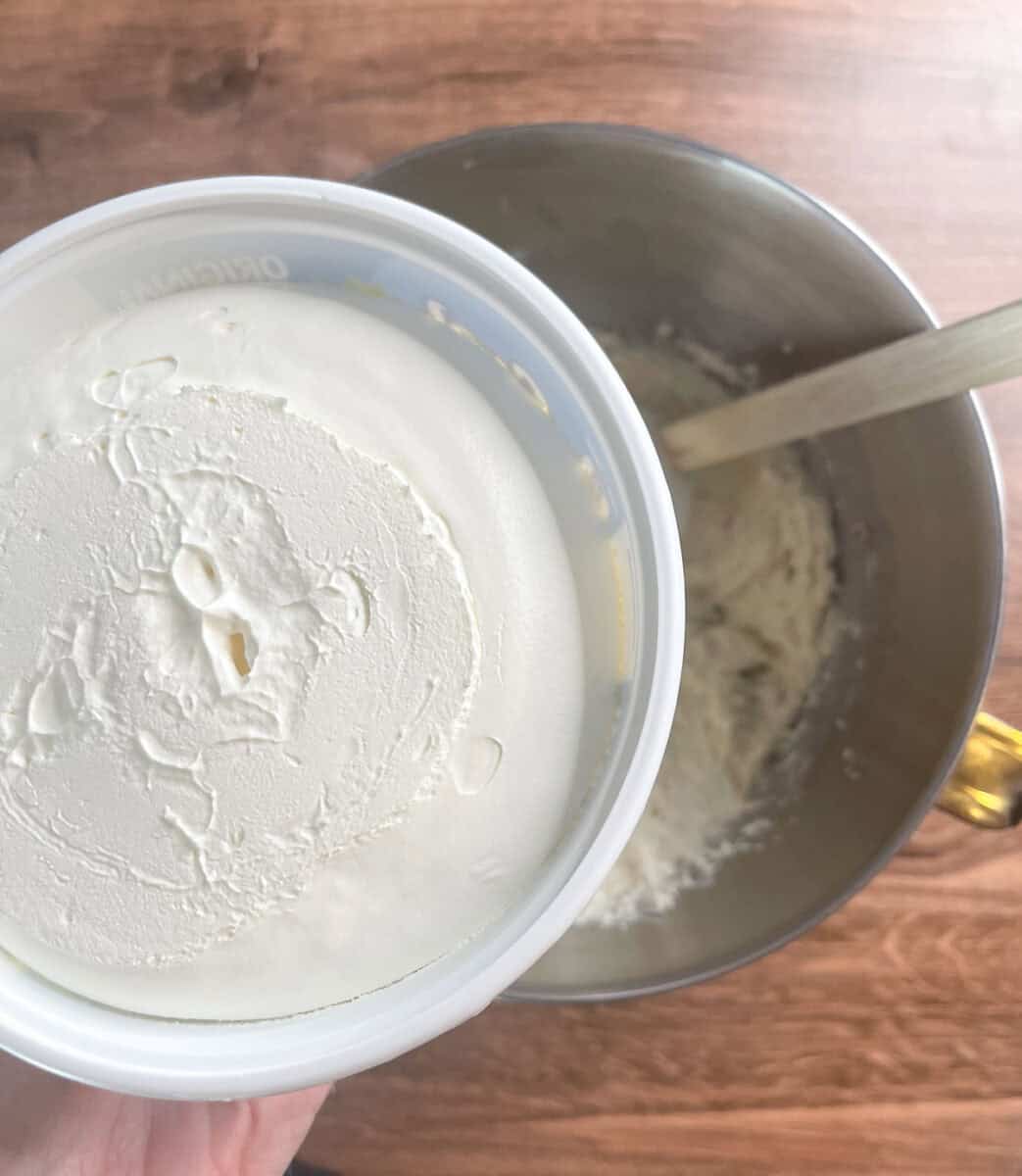 about to add in the whipped topping to the cake mixture