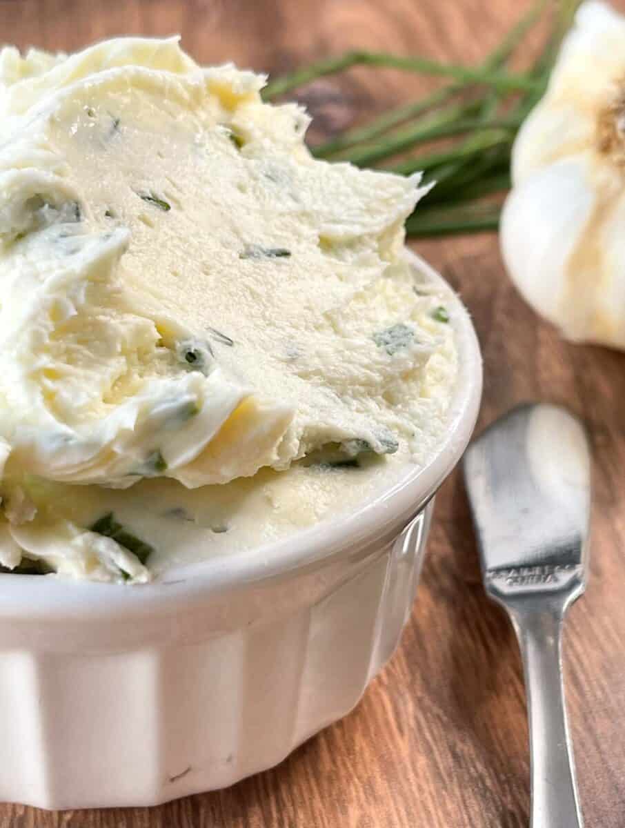 very closeup view of cream cheese spread in white small bowl